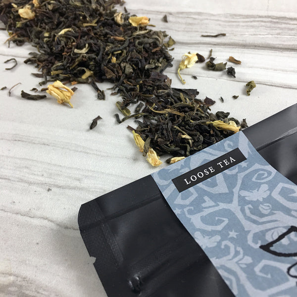 Jasmine tea spilling out of black bag, Loose Tea, Great graphics band with spooky vine, DemBones Shoppe Tea